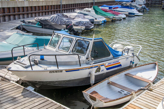 WATERTON LAKES, ALBERTA, CANADA - 22 AUGUST 2026: RCMP Police Border Enforcement Patrol Boat Docked at Marina