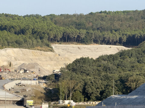 View of construction site with heavy machinery and earthworks near the forest in Sariyer, Istanbul, Turkiye.