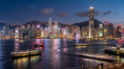 Naklejka premium Hong Kong city skyline and Victoria Harbour at night.