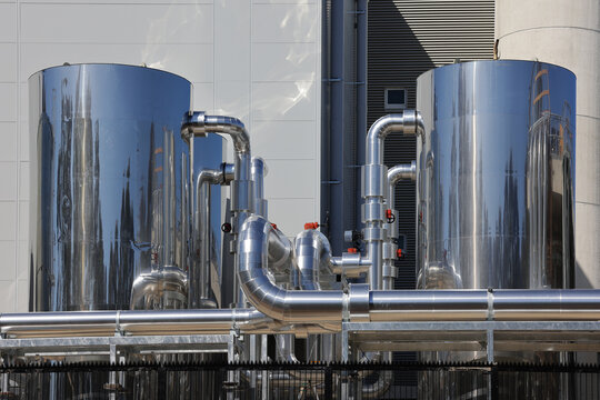 View of data centre cooling plant with insulated cylindrical vessels and pipework