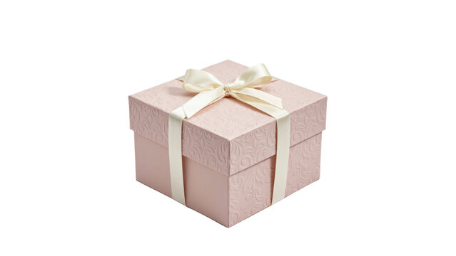 Square pink gift box with embossed floral pattern and cream satin ribbon bow isolated on a transparent background