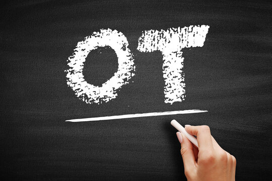 OT stands for Overtime, referring to an extra period of play in sports when the score is tied, or extra work hours, written in chalk on a textured school board surface