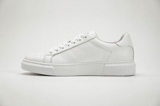 Classic white leather sneaker isolated on white background