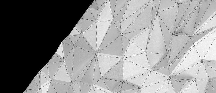 A detailed close-up of a white geometric surface with textured triangles and a dark background.