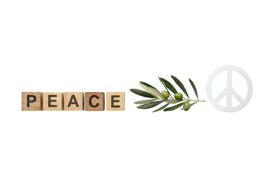 Peace wooden letters with olive branch and symbol on white, concept of harmony and tranquility, still life composition