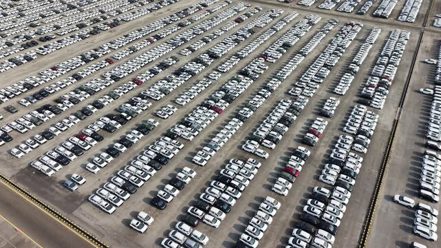 Aerial view of rows of new cars parked at a large manufacturing facility in Chennai, Tamil Nadu, India.