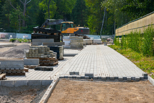 Concrete Paving Block Walkway Installation at Active Construction Site
