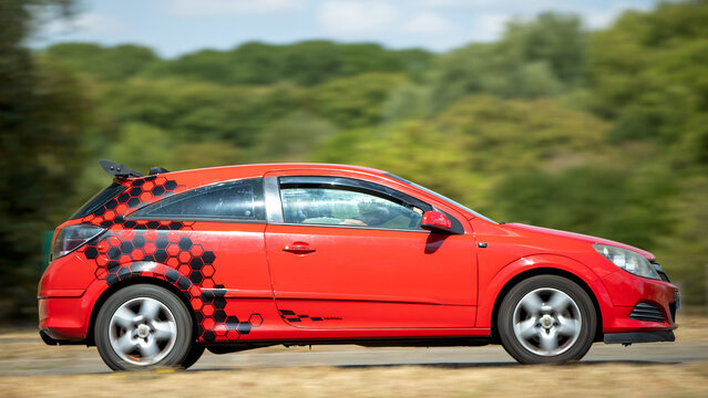 Milton Keynes,UK - Aug 22nd 2026: 2008 red Vauxhall Astra car driving on a British road