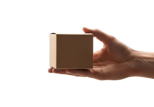 A hand holding a small brown cardboard box isolated on transparent background