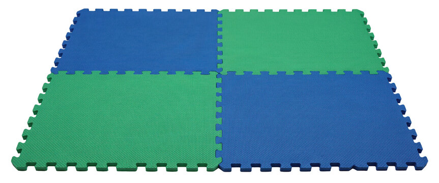 Four interlocking foam floor mats in alternating blue and green colors arranged in a square grid pattern isolated on a transparent background