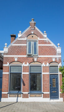 Traditional brick facade and a decorative gable on an old house in Meppel, Netherlands