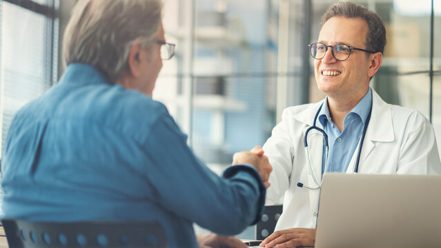 Doctor shakes hands with a patient