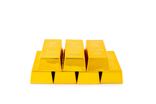 Gold bars isolated on white background. Stack of many shiny gold bars. Fine gold concept. Gold panel background.  Metallic texture. Wealth, luxury, treasure.