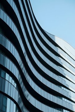 Contemporary Office Building With Elegant Wave Shaped Glass Exterior