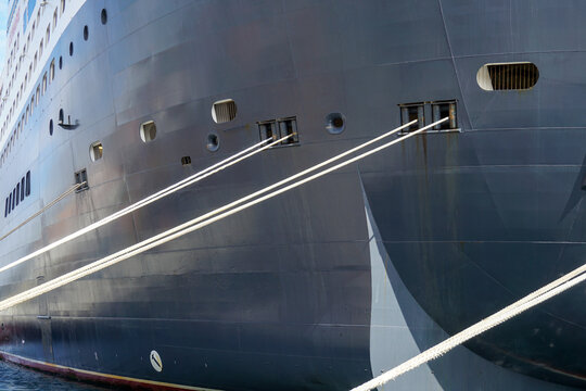Cruise ship mooring ropes securing vessel to dock