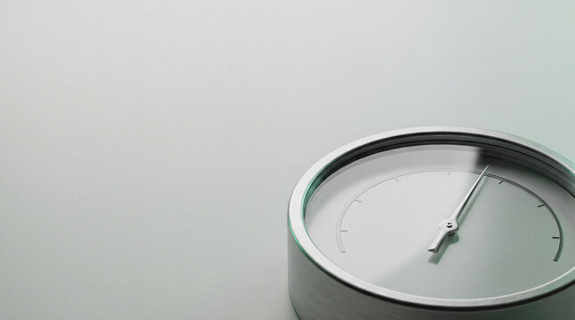 Close up of analog hygrometer gauge measuring humidity with metal rim on grey background