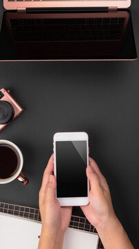 Rose gold laptop and phone setup