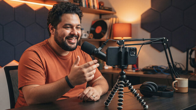 Man records content with smartphone and microphone