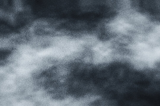 Abstract grainy dark blue and gray texture background featuring cloudy patterns, suitable for mystical designs or artistic backdrops.