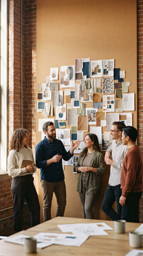 Brand agency team collaborates near mood board