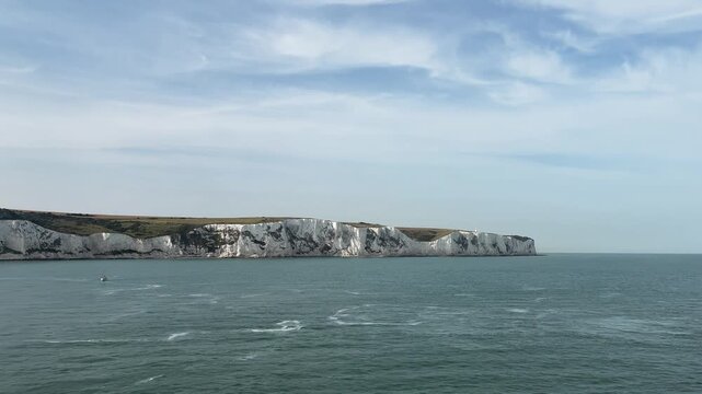 Beautiful dramatic landscape of the iconic White Cliffs of Dover and English coastline viewed from the sea, United Kingdom.