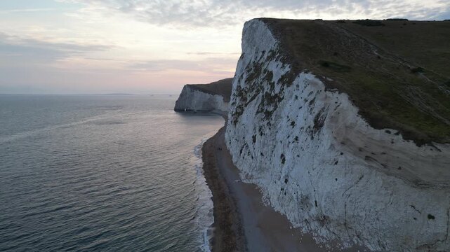 Drone fly forward shot approaching white chalk cliffs at Bats Head Dorset