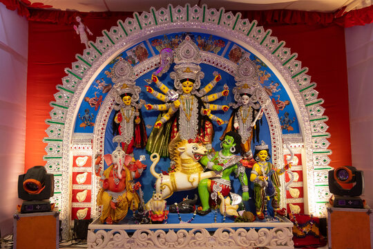 Narayanganj, Dhaka, Bangladesh - 20 October 2023: View of the vibrant Durga Puja idol featuring Goddess Durga and Mahishasura, displayed in a festive pandal with traditional decorations.