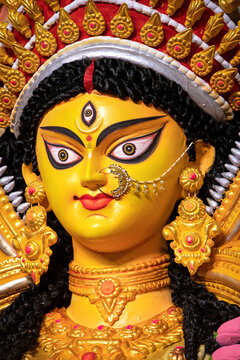 Narayanganj, Dhaka, Bangladesh - 22 October 2020: View of the Durga Puja idol, featuring golden jewelry, a nose ring, and vibrant facial details during the Hindu festival.