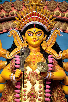 Narayanganj, Dhaka, Bangladesh - 22 October 2020: View of the intricately crafted idol of Goddess Durga adorned with a golden crown and traditional jewelry during the Durga Puja festival.