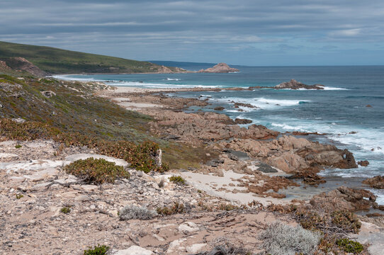 White surf curving around an undeveloped Australian shore