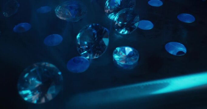 Abstract blue faceted diamonds floating on illuminated surface for dreamy jewelry wallpaper for laboratory mining factory.