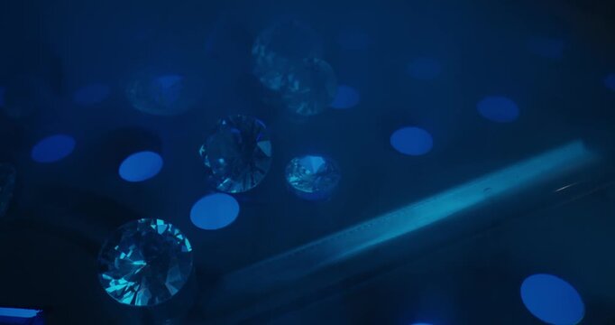 Lab diamonds floating on illuminated surface for dreamy jewelry wallpaper for laboratory of mining factory.