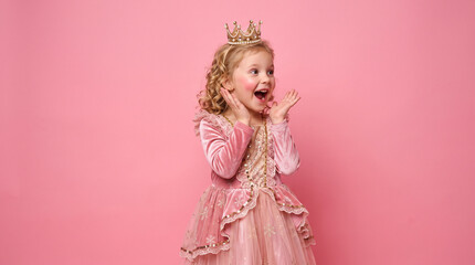 Fototapeta premium Little princess with crown isolated on pink background doing surprise gesture while looking to the side Christmas 2027 