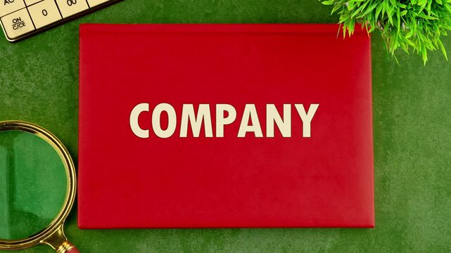The word company appears on a red notebook