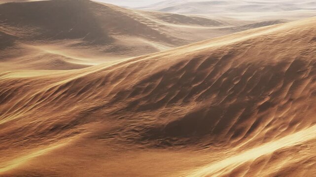 The scene shows sand dunes in a desert with soft waves and ridges under sunlight. The sun creates shadows and highlights across the surface. The atmosphere feels warm.