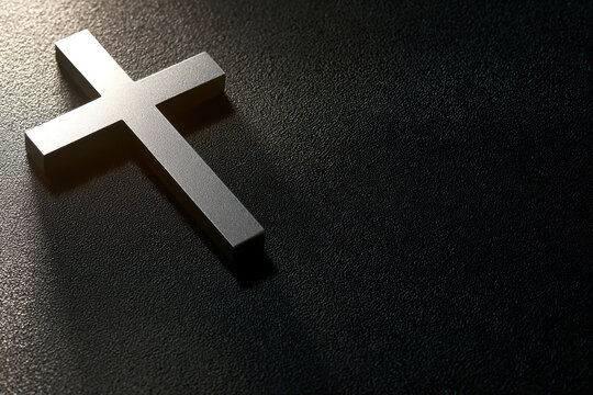A cross rests on a dark surface, symbolizing faith. The lighting highlights the shape of the cross, creating a simple yet profound scene in a dim setting