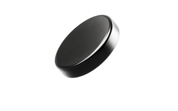 Lens cap caught in midair during a bouncing action creating a dramatic slow motion style visual for photography and camera concepts