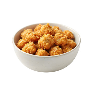 A bowl filled with crispy golden fried popcorn chicken bites, isolated on transparent background
