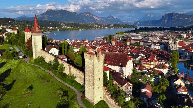 drone view of historic Swiss town of Lucerne in Switzerland, flying above Luzern, medieval Chapel bridge and Lucerne lake, tourism and travel in Switzerland