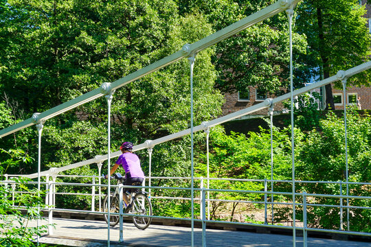 Cyclist riding Aamodt bridge in Oslo, Norway