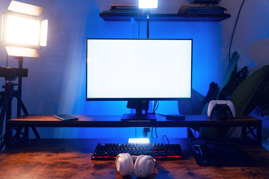Professional streaming setup with illuminated computer screen