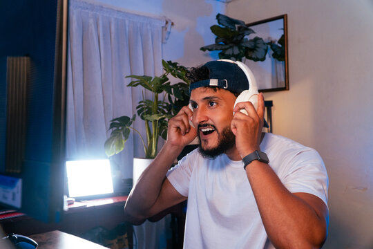 Young adult man enjoying gaming and live streaming