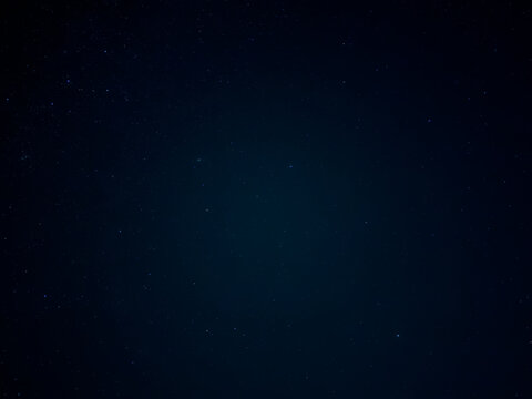 Dark Starry Night Sky With Deep Blue Glow