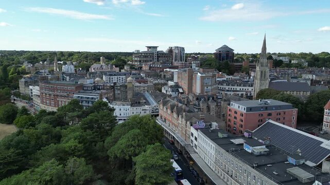 Slow drone pull back shot revealing St Peters Church cityscape in Bournemouth