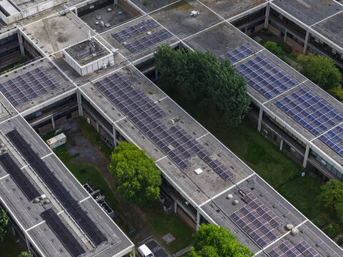 Aerial view of the University of Galway Research and Innovation Centre featuring extensive rooftop solar panel arrays and surrounding green spaces in Galway, County Galway, Ireland.