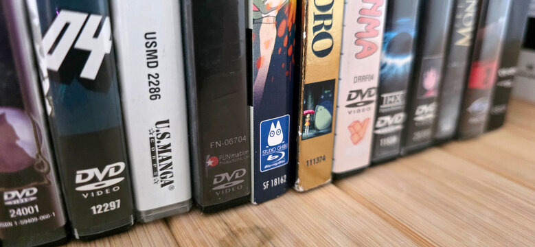 angled closeup of row of classic anime dvd cases with spines facing out, including studio ghibli and my neighbor totoro, August 25, 2026 Schaumburg, IL