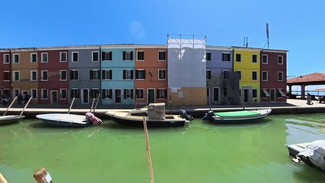 Colorful Houses and Boats Along a Burano Canal in Venice, Italy