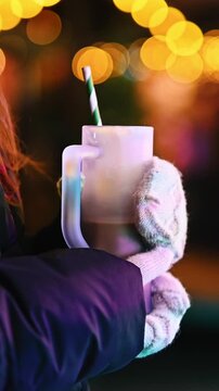 Girl Holding Cocoa At Christmas Market In The Evening. Close-up, Vertical Video