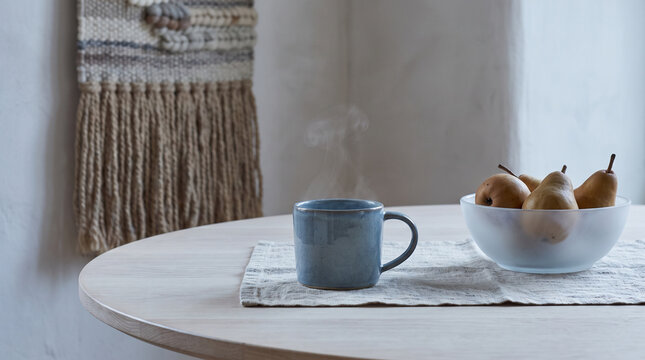 Steaming blue ceramic cup in a winter breakfast nook