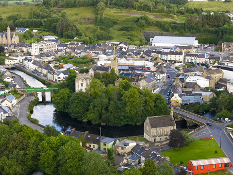 Aerial view of the historic Donegal Castle, the River Eske, stone bridges, and surrounding lush green landscape of Donegal, County Donegal, Ireland.